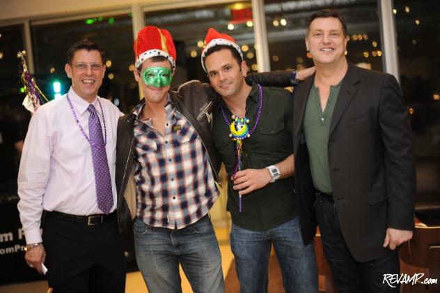 Vida Fitness' James Kameen and Room & Board's Scott Jussila flank the night's raffle winners.